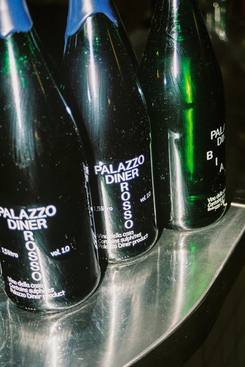 Palazzo Diner Rosso house wine bottles