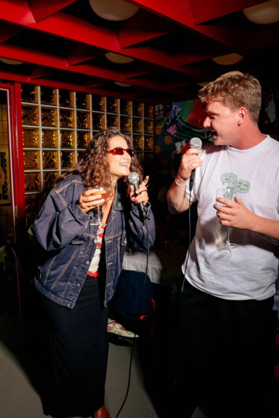 Two guests singing in the karaoke room