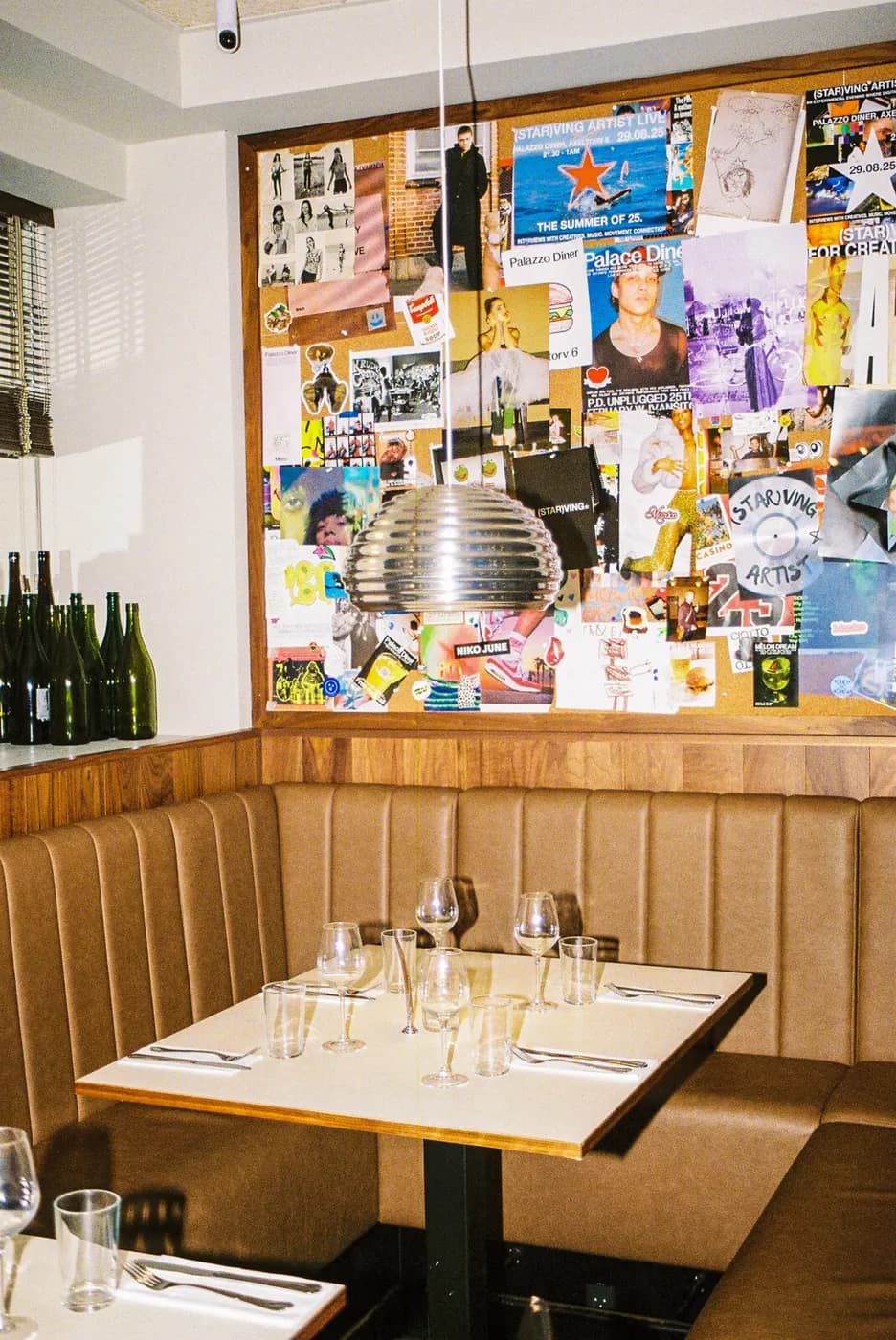 The dining room with booths and the photo wall